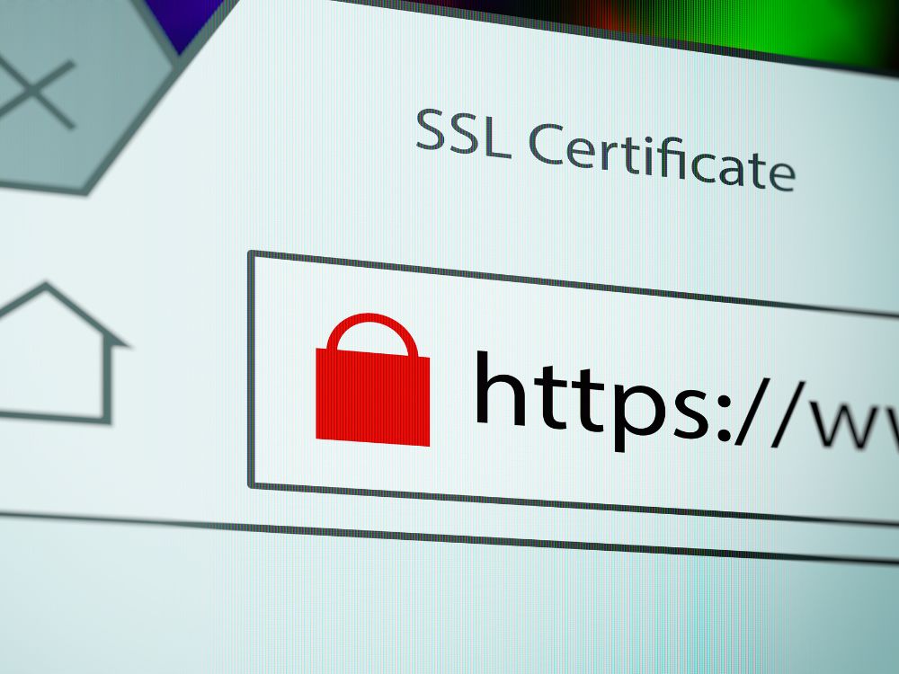 Barra de endereço com HTTPS e cadeado vermelho, destacando certificado digital e a importância do SSL na segurança de sites.